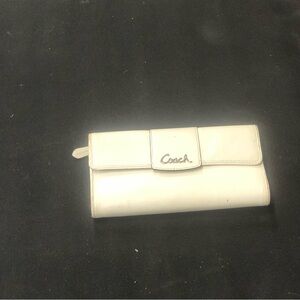 Coach Cream Women's Wallet. Sleek design, signature logo.